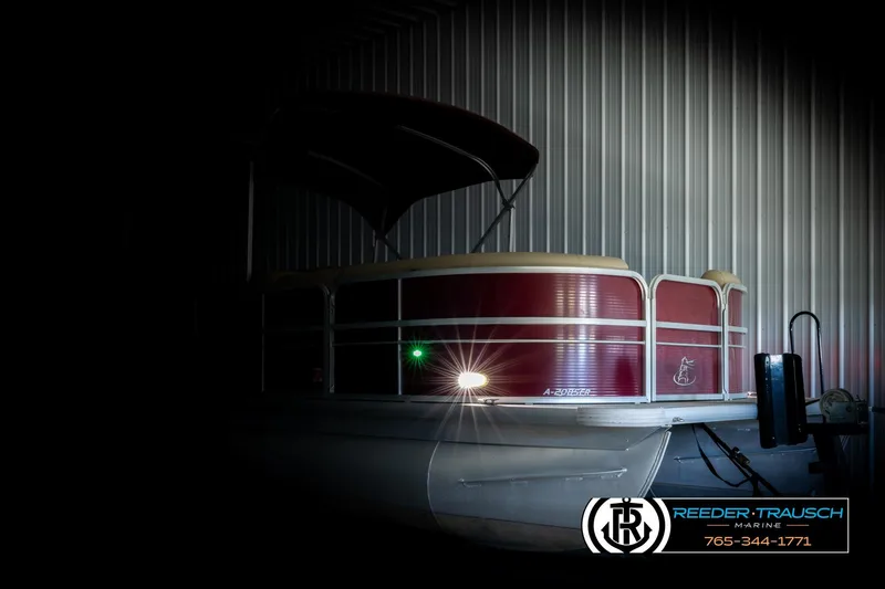 Slide: The Image of 2018 Misty Harbor 2085 CR pontoon boat in a dimly lit storage area. - 4