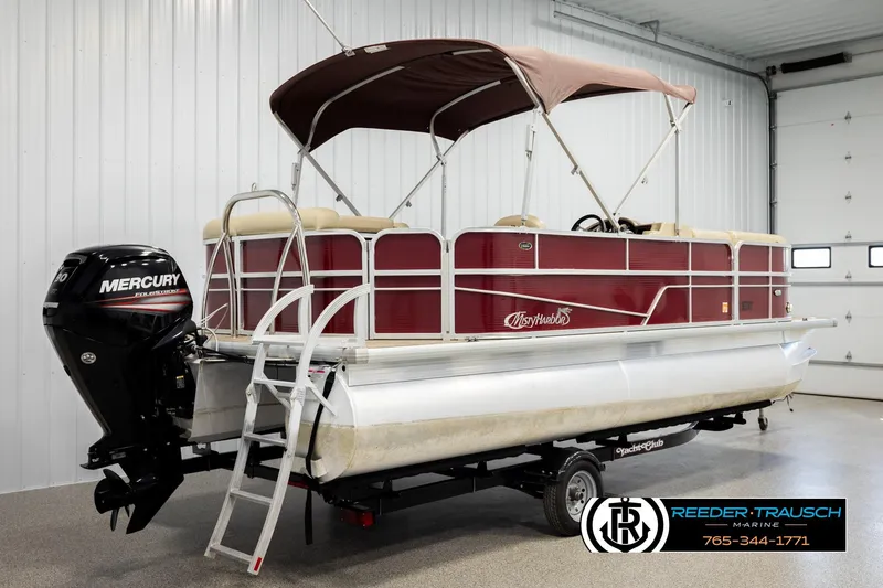 Slide: The Image of 2018 Misty Harbor 2085 CR pontoon boat with Mercury outboard motor in indoor showroom. - 6