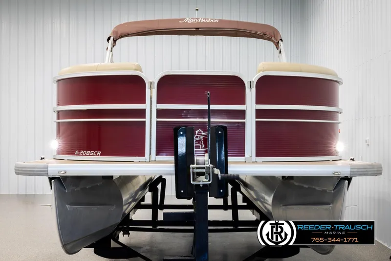 Slide: The Image of 2018 Misty Harbor 2085 CR pontoon boat in showroom, red and beige design. - 8
