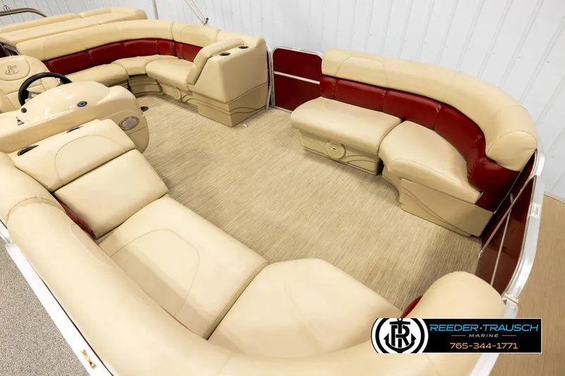 Slide: The Image of 2018 Misty Harbor 2085 CR pontoon boat with beige and red seating, showcased indoors. - 9