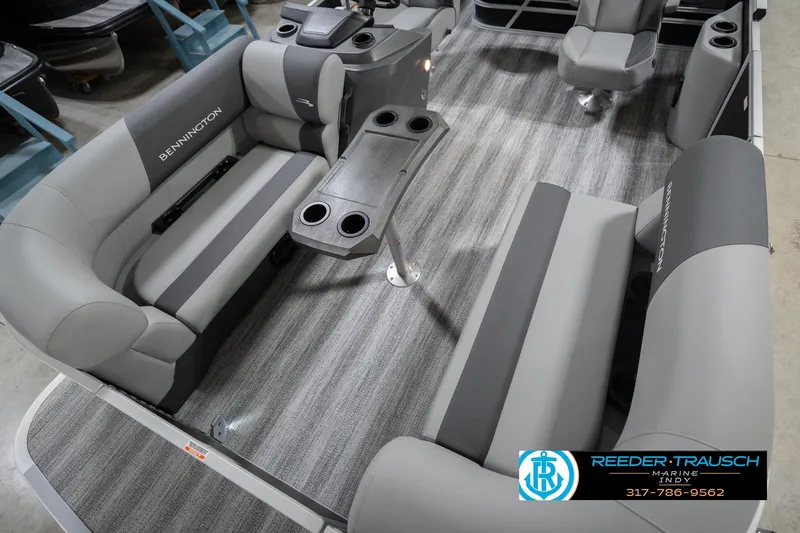 Slide: The Image of Interior of 2026 Bennington 20 SSB pontoon boat with gray seating and cup holders. - 12