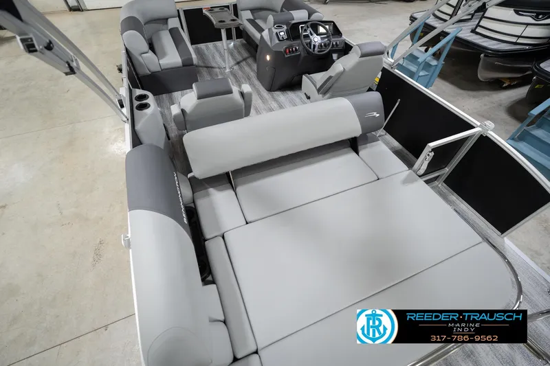 Slide: The Image of 2026 Bennington 20 SSB pontoon boat interior with gray seating and modern dashboard. - 15