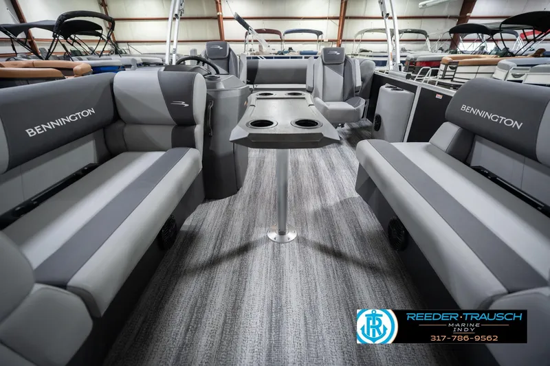 Slide: The Image of Interior of 2026 Bennington 20 SSB pontoon boat with gray seating and table. - 16