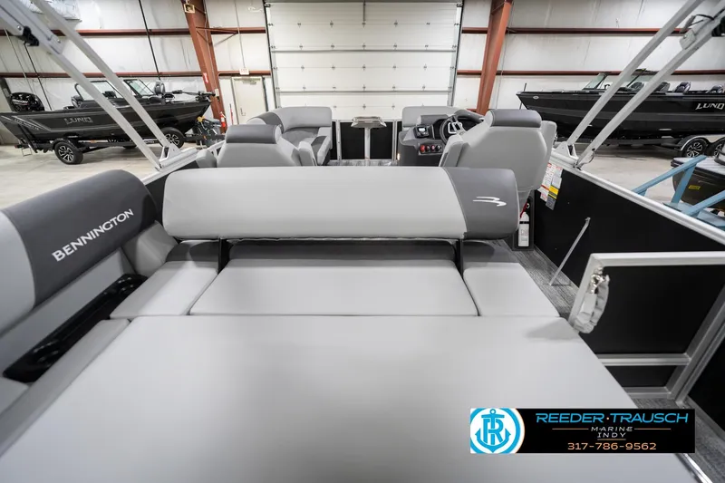 Slide: The Image of 2026 Bennington 20 SSB pontoon boat interior with gray seating in a showroom. - 19