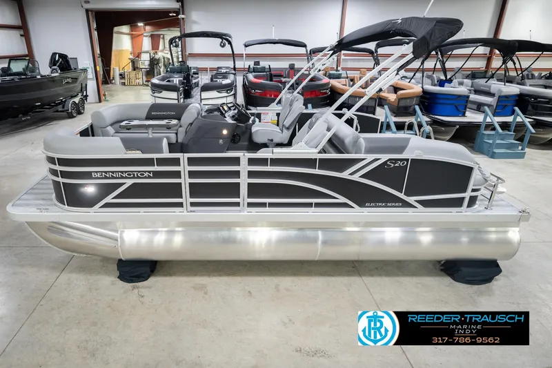 The Image of 2026 Bennington 20 SSB pontoon boat in showroom, featuring sleek design and modern amenities. - 2