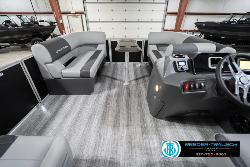 Slide: The Image of 2026 Bennington 20 SSB pontoon boat interior with modern seating and steering console. - 20
