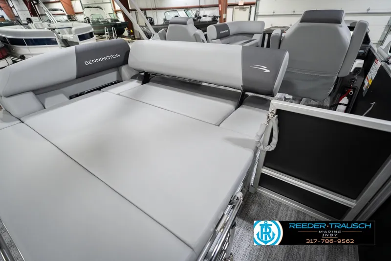 Slide: The Image of 2026 Bennington 20 SSB pontoon boat interior with gray seating in showroom. - 27