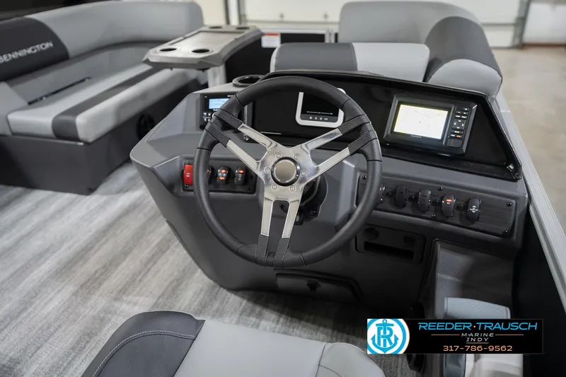Slide: The Image of 2026 Bennington 20 SSB boat interior with steering wheel and control panel. - 29