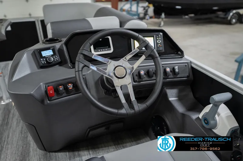 Slide: The Image of 2026 Bennington 20 SSB boat dashboard with steering wheel and control panel. - 30