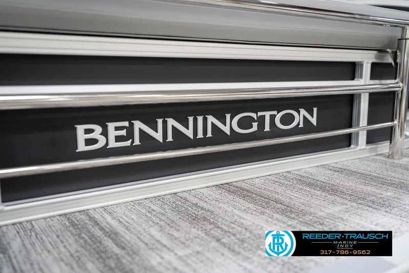 Slide: The Image of 2026 Bennington 20 SSB boat with sleek metal railing and logo. - 50