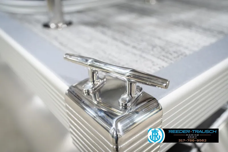Slide: The Image of Close-up of a 2026 Bennington 20 SSB boat cleat with Reeder-Trausch Marine logo. - 52