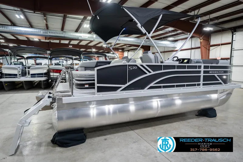 Slide: The Image of 2026 Bennington 20 SSB pontoon boat in showroom with canopy and sleek design. - 8