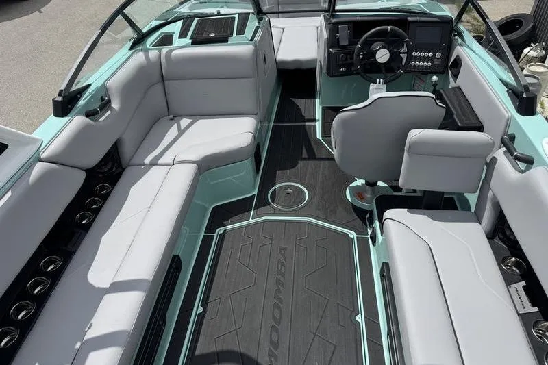 Slide: The Image of 2025 Moomba Max boat interior with sleek seating and modern dashboard design. - 5
