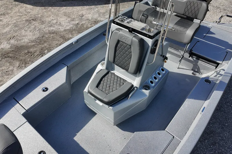 Slide: The Image of 2026 Xpress H20B Bay boat interior with gray seating and console, featuring modern design elements. - 10