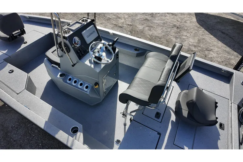 Slide: The Image of 2026 Xpress H20B Bay boat interior with steering console and seating. - 12