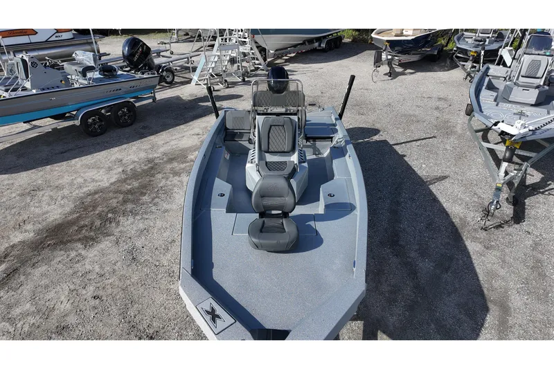 Slide: The Image of 2026 Xpress H20B Bay boat displayed in a marina with other boats. - 15