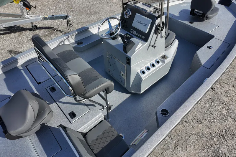 Slide: The Image of 2026 Xpress H20B Bay boat interior with seating and Garmin console. - 6