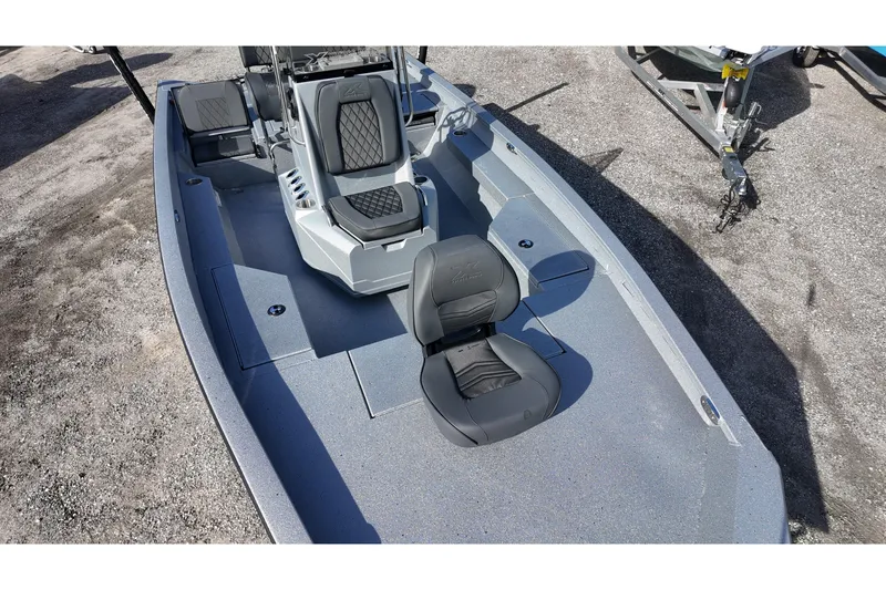 Slide: The Image of 2026 Xpress H20B Bay boat interior with seating and storage compartments. - 8