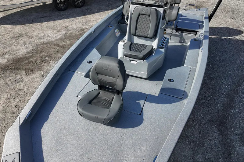 Slide: The Image of 2026 Xpress H20B Bay boat interior with gray seating and console. - 9