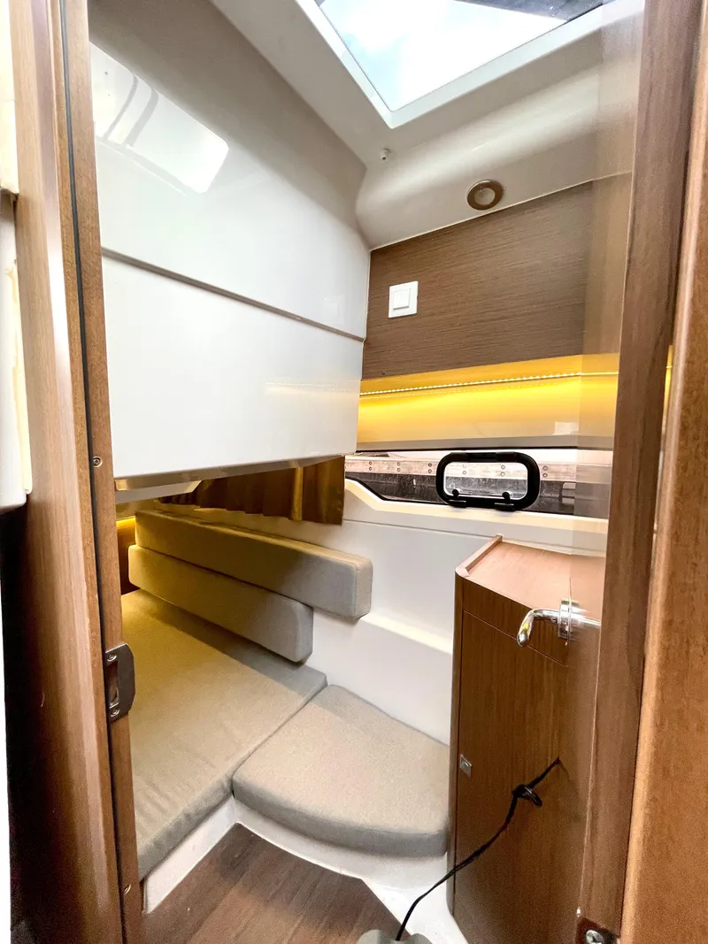 Slide: The Image of 2019 Jeanneau NC 895 cabin interior with modern design and cozy seating. - 11