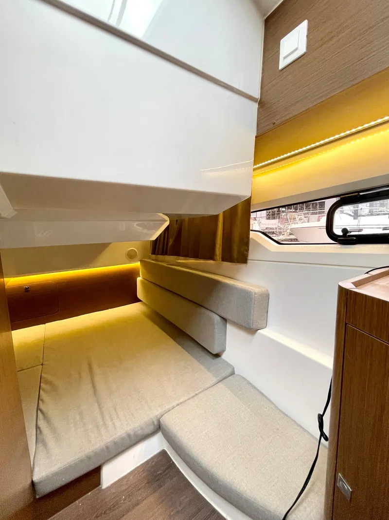 Slide: The Image of Interior cabin of 2019 Jeanneau NC 895 with modern design and ambient lighting. - 12