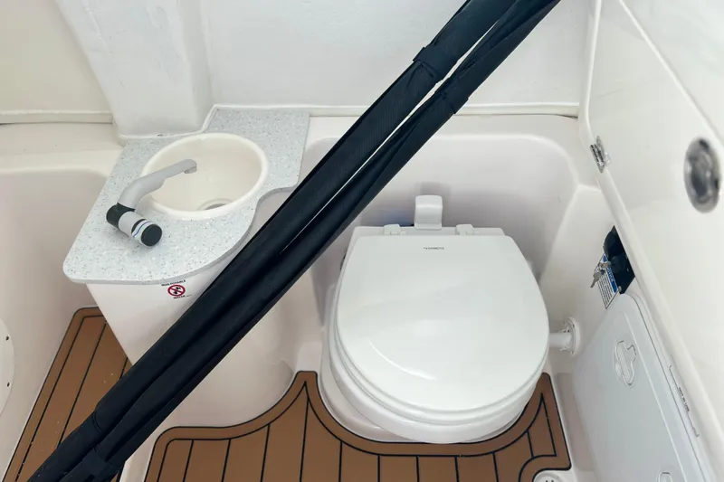 Slide: The Image of 2026 Sea Fox 268 Commander boat bathroom with sink and toilet. - 17