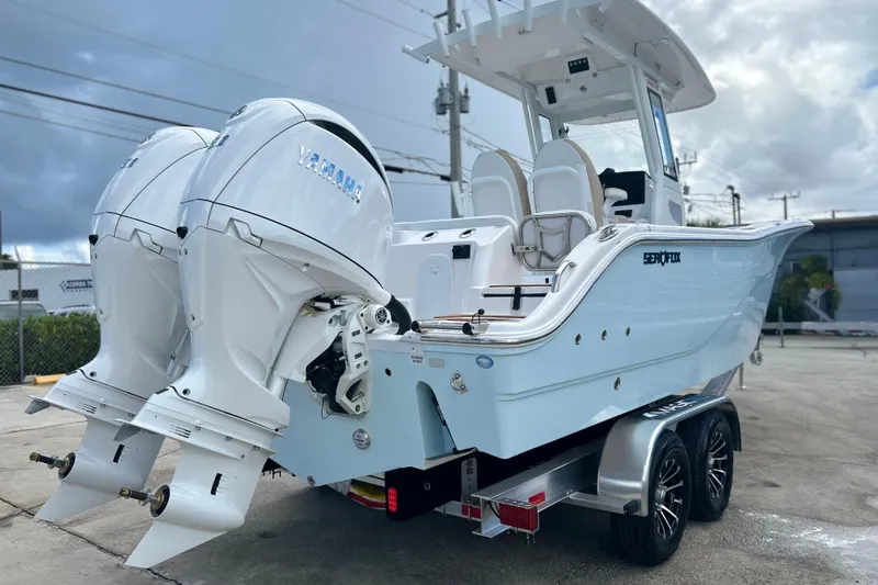Slide: The Image of 2026 Sea Fox 268 Commander boat with dual Yamaha engines on a trailer. - 26