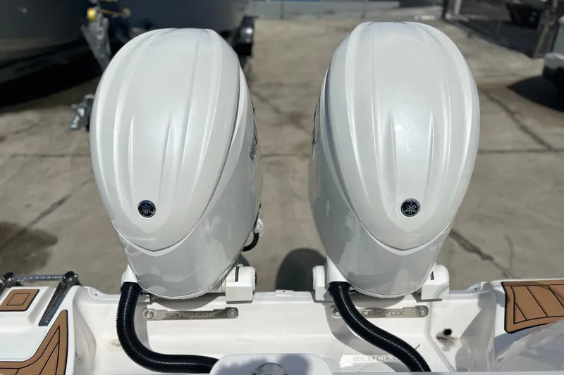 Slide: The Image of Twin outboard engines on a 2026 Sea Fox 268 Commander boat, viewed from the rear. - 44