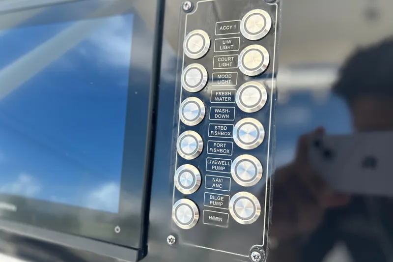 Slide: The Image of Control panel of 2026 Sea Fox 268 Commander boat with labeled buttons. - 5