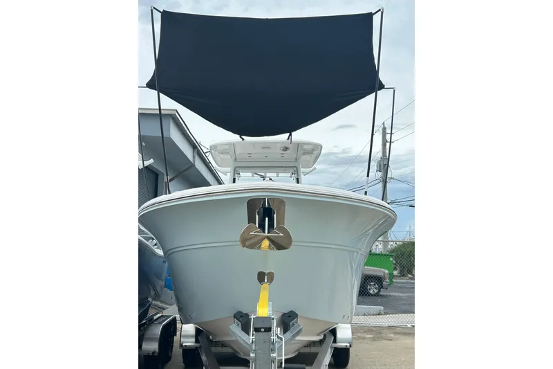 Slide: The Image of 2026 Sea Fox 268 Commander boat on trailer with canopy, front view. - 56