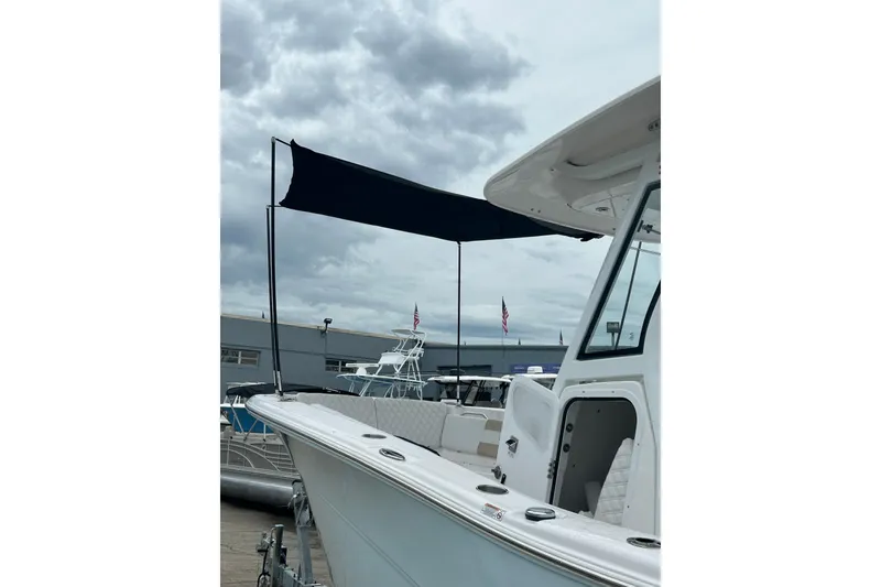 Slide: The Image of 2026 Sea Fox 268 Commander boat with canopy under cloudy sky. - 57
