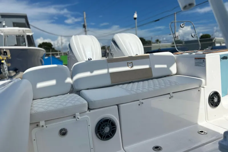 Slide: The Image of 2026 Sea Fox 268 Commander boat interior with white seating and speakers. - 9