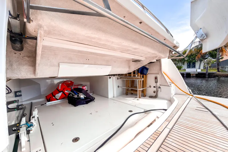 Slide: The Image of 2015 Beneteau Gran Turismo 49 yacht storage area with life jackets and equipment. - 13