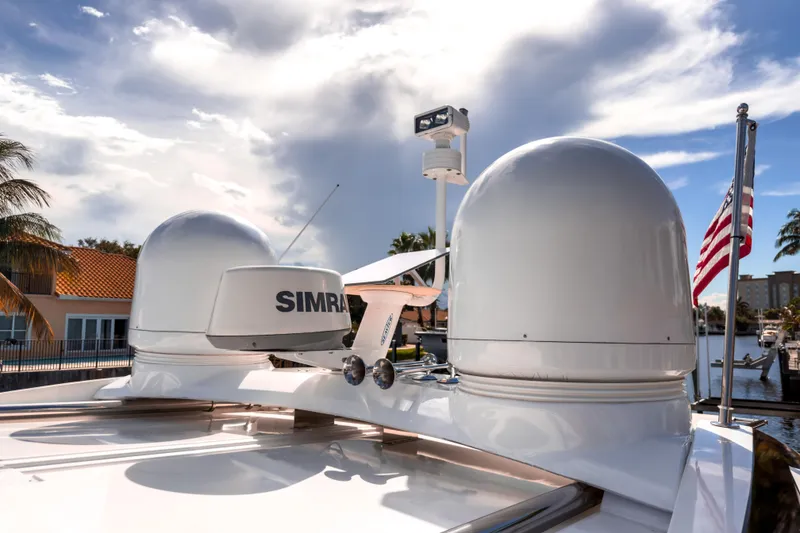 Slide: The Image of Radar equipment on 2015 Beneteau Gran Turismo 49 yacht under a partly cloudy sky. - 17