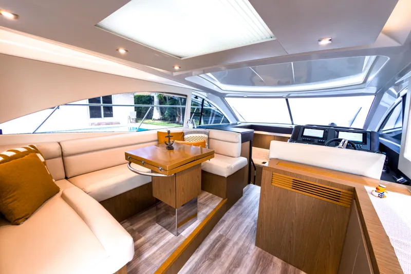 Slide: The Image of Luxurious interior of 2015 Beneteau Gran Turismo 49 yacht with modern seating and navigation area. - 18