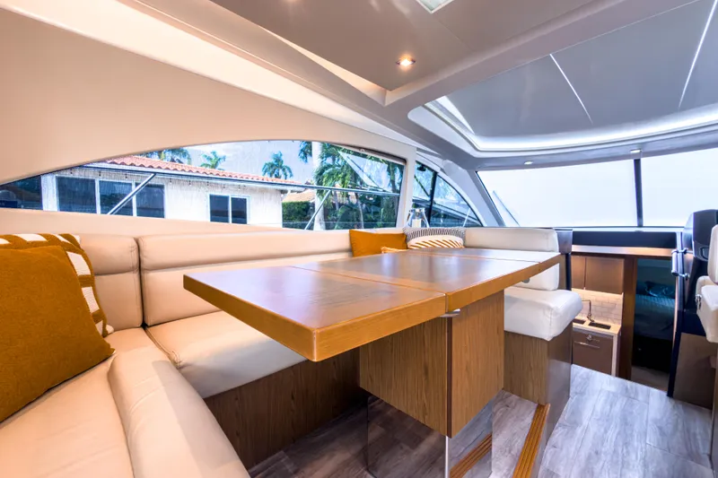 Slide: The Image of Luxurious interior of 2015 Beneteau Gran Turismo 49 yacht with elegant seating and wooden table. - 19