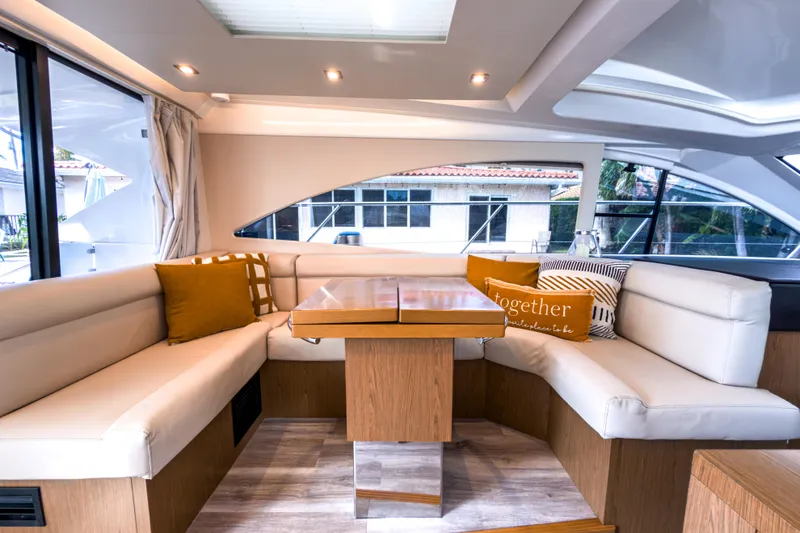 Slide: The Image of Luxurious interior of 2015 Beneteau Gran Turismo 49 yacht with elegant seating and cushions. - 20