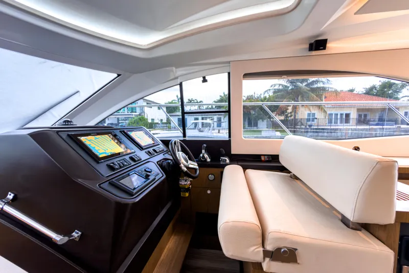 Slide: The Image of Interior helm of 2015 Beneteau Gran Turismo 49 yacht with modern navigation displays. - 24