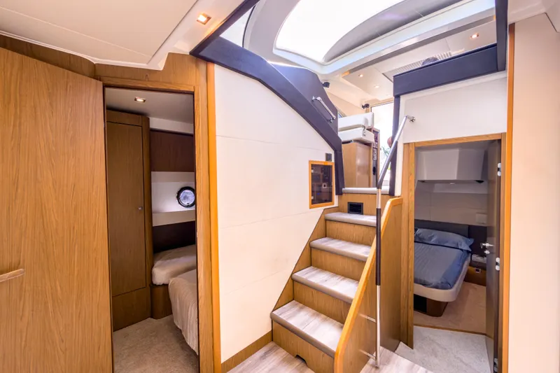 Slide: The Image of Luxurious interior of 2015 Beneteau Gran Turismo 49 yacht with wooden finishes and cozy cabins. - 26