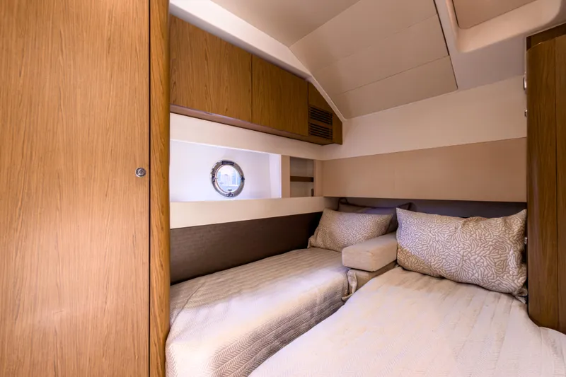 Slide: The Image of Luxurious cabin interior of 2015 Beneteau Gran Turismo 49 yacht with twin beds. - 27