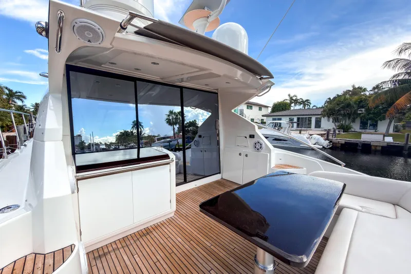 Slide: The Image of 2015 Beneteau Gran Turismo 49 yacht deck with sleek design and waterfront view. - 3