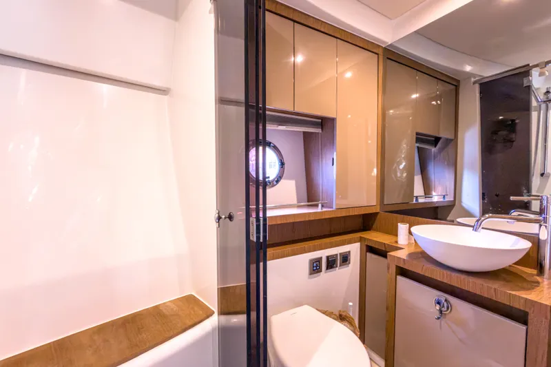 Slide: The Image of Luxurious bathroom in 2015 Beneteau Gran Turismo 49 yacht, featuring modern fixtures and elegant design. - 33
