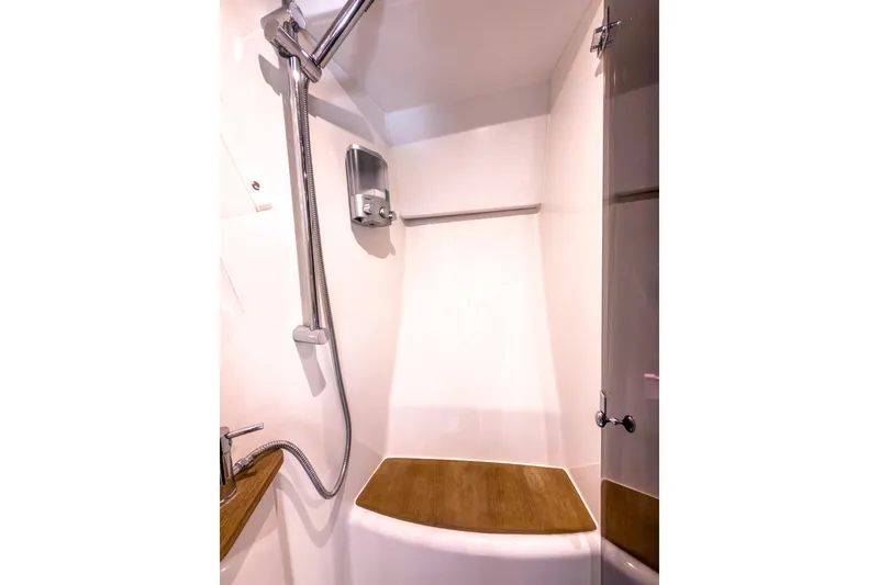 Slide: The Image of Shower area in 2015 Beneteau Gran Turismo 49 yacht, featuring modern fixtures and wooden accents. - 34