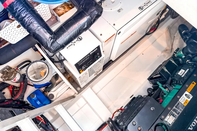 Slide: The Image of Engine room of 2015 Beneteau Gran Turismo 49 with Cummins Onan generator and Volvo engine. - 36