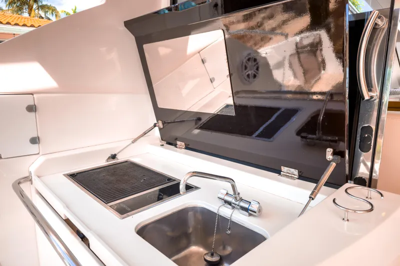 Slide: The Image of 2015 Beneteau Gran Turismo 49 yacht kitchen with sink and grill. - 9