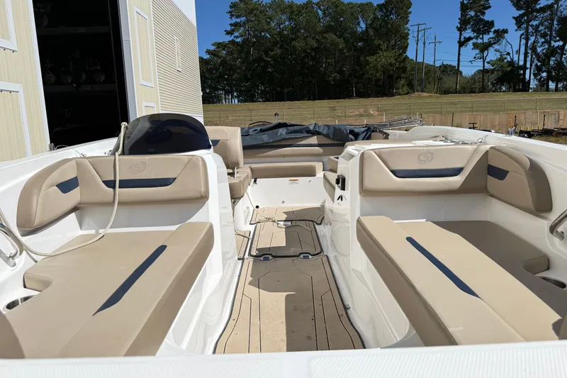 Slide: The Image of 2021 Hurricane SunDeck Sport 205 IO boat interior with beige seating and open layout. - 15