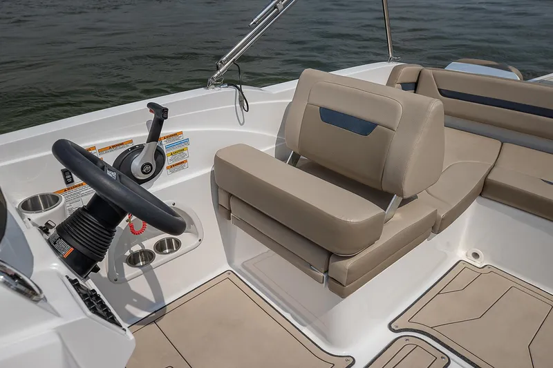 Slide: The Image of 2021 Hurricane SunDeck Sport 205 IO boat, rear view, docked outdoors. - 6