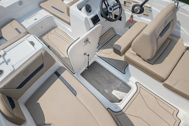 Slide: The Image of 2021 Hurricane SunDeck Sport 205 IO boat with beige seating and modern dashboard. - 7