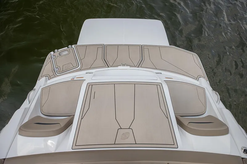 Slide: The Image of 2021 Hurricane SunDeck Sport 205 IO boat interior with beige seating and control panel. - 8