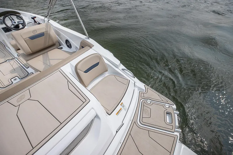 Slide: The Image of 2021 Hurricane SunDeck Sport 205 IO boat interior with beige seating and control panel. - 9